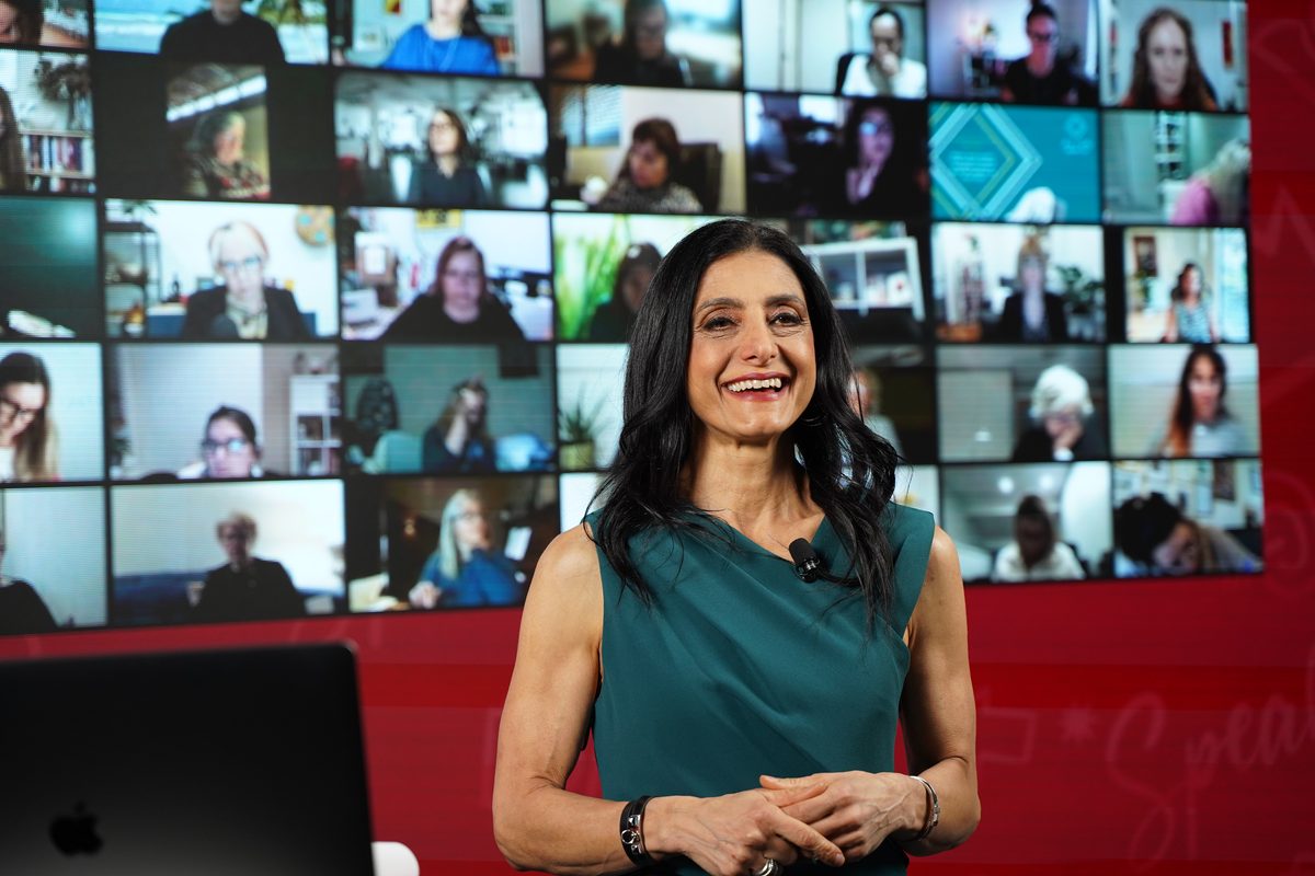 Suzi Dafnis hosting a live HerBusiness Growth Shift conversation with members on screen